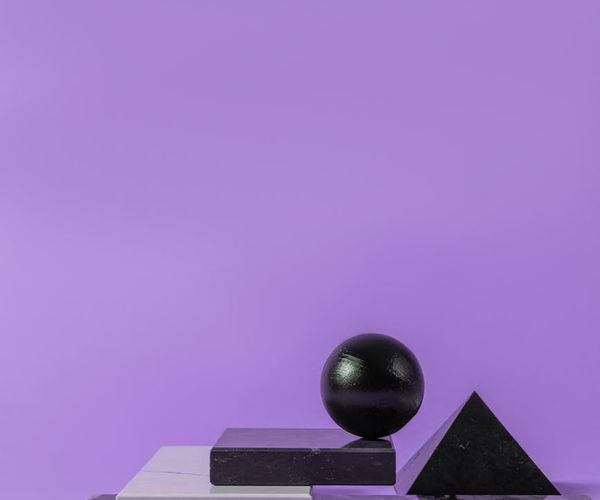 Balanced stones in abstract purple light environment